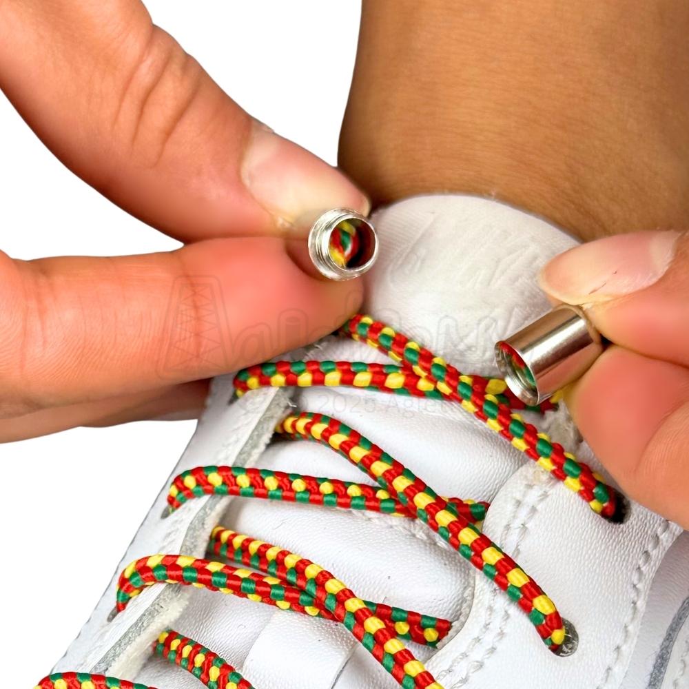 Elastische veters zonder strikken driehoek 3mm capsule sluiting rood geel groen detailfoto van hoe de sluiting werkt