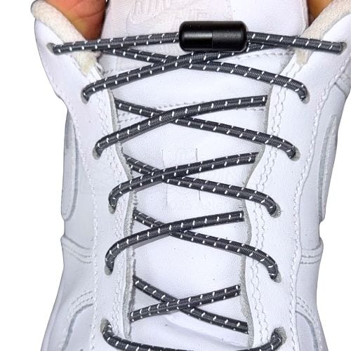 Elastische veters zonder strikken reflecterend 3mm capsule sluiting donkergrijs met stretch uitgerekt uitgelichte afbeelding