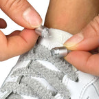 Elastische veters zonder strikken fluffy 7mm capsule sluiting grijs detailfoto van hoe de sluiting werkt