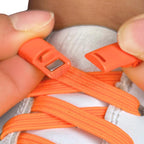 Elastische veters zonder strikken plat 7mm magnetische sluiting oranje detailfoto van hoe de sluiting werkt