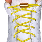 Elastische veters zonder strikken reflecterend 3mm capsule sluiting geel met stretch uitgerekt