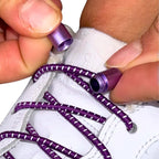 Elastische veters zonder strikken reflecterend 3mm capsule sluiting paars detailfoto van hoe de sluiting werkt