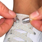 Elastische veters zonder strikken reflecterend 7mm capsule sluiting beige detailfoto van hoe de sluiting werkt