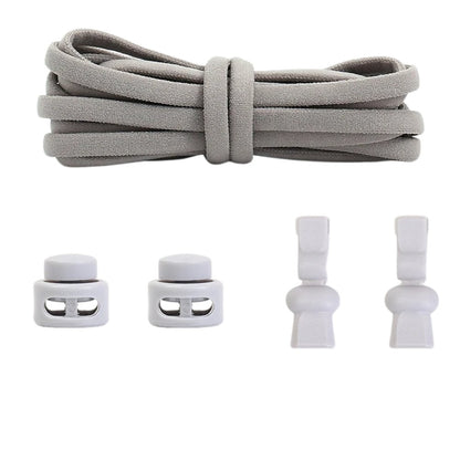 Gray compact elastic no-tie shoelaces with an adjustable lock.