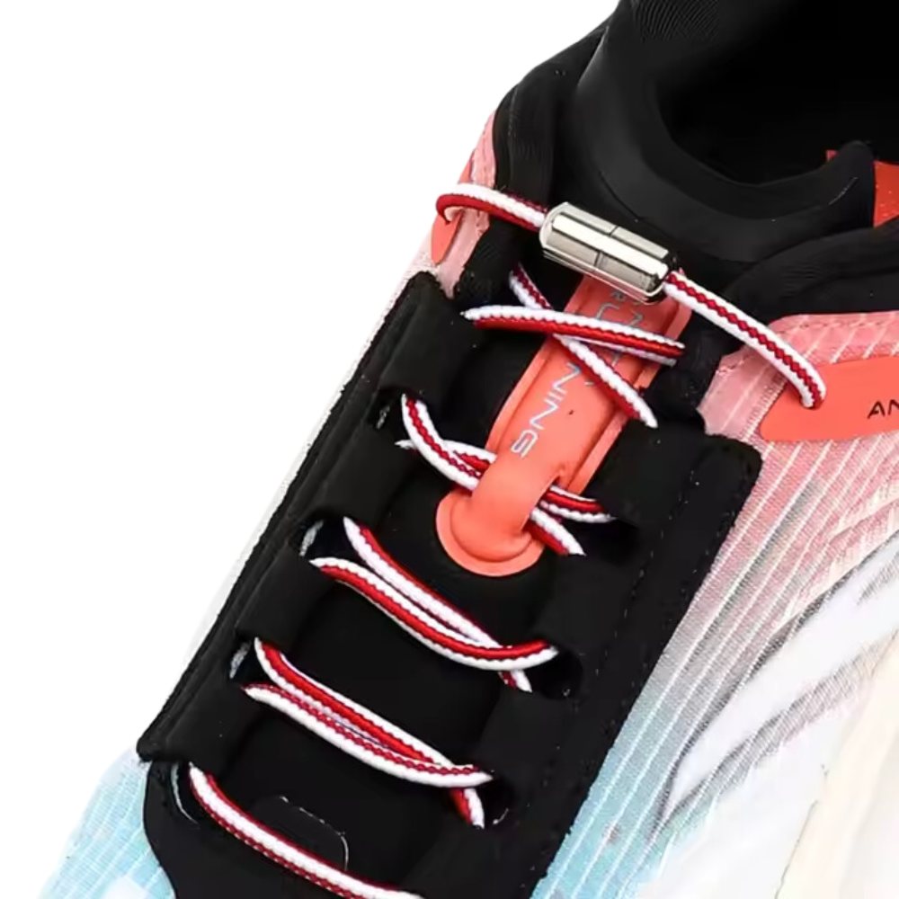 Red and white Extra Strong elastic no-tie shoelaces with capsule lock displayed on a shoe